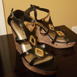 Black and gold wedge heels